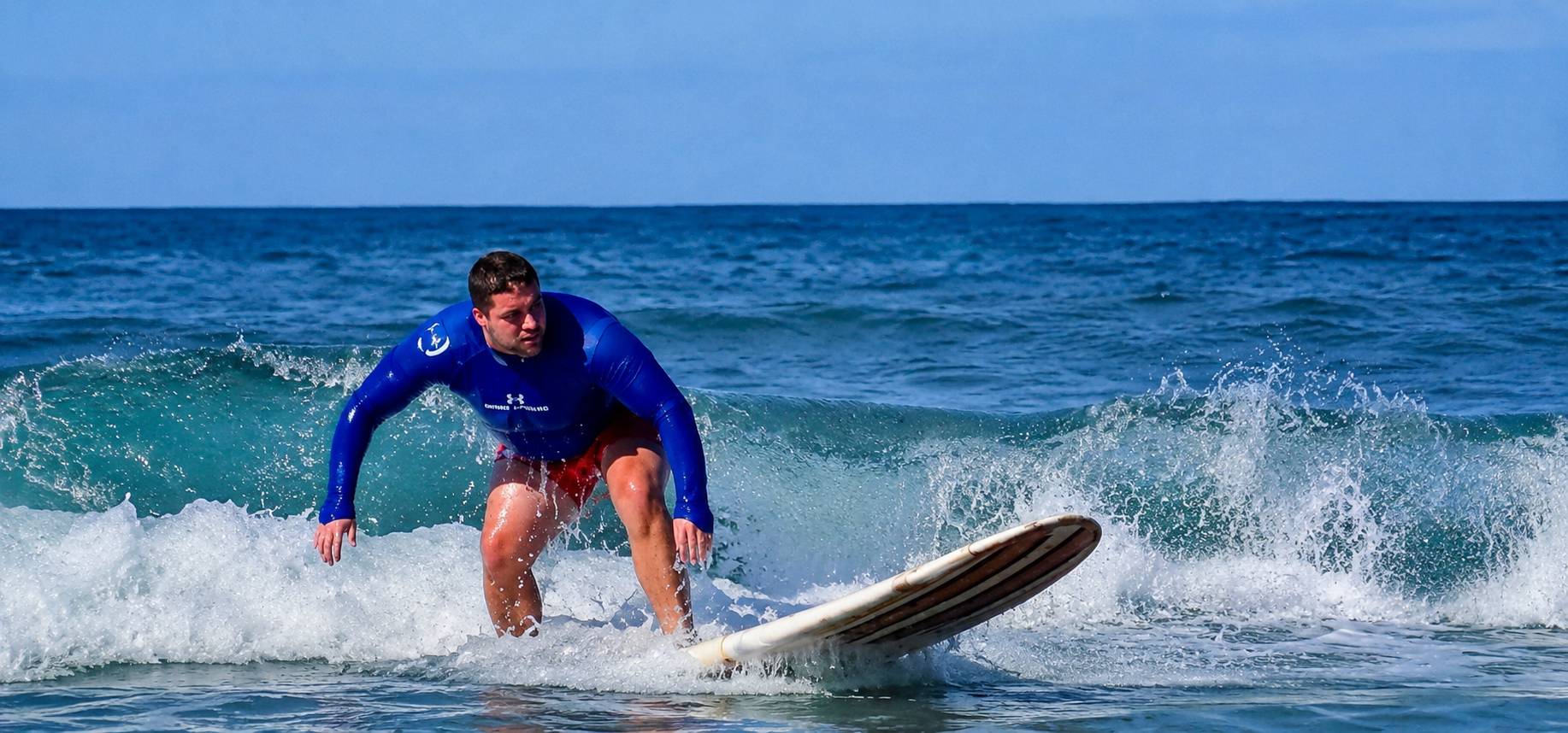 Ryan surfing a wave