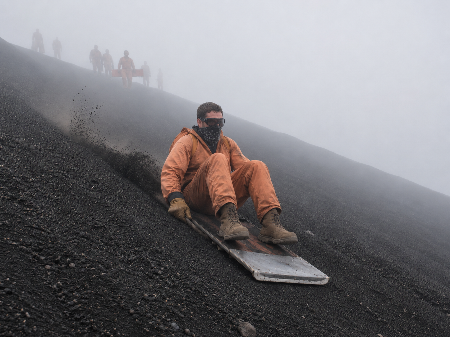 Ryan volcano boarding down a black ash slope